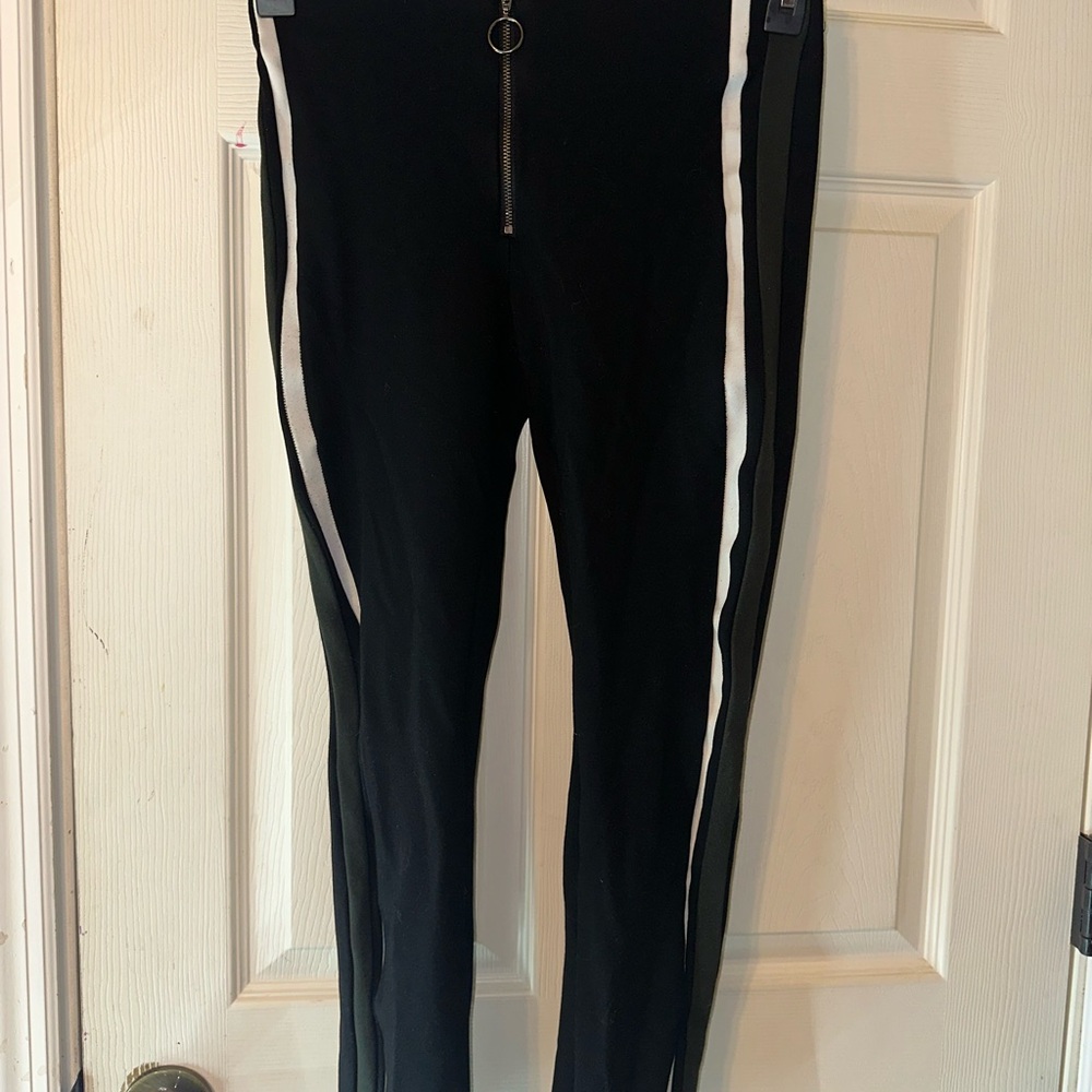 Black Pants with White and green stripes.